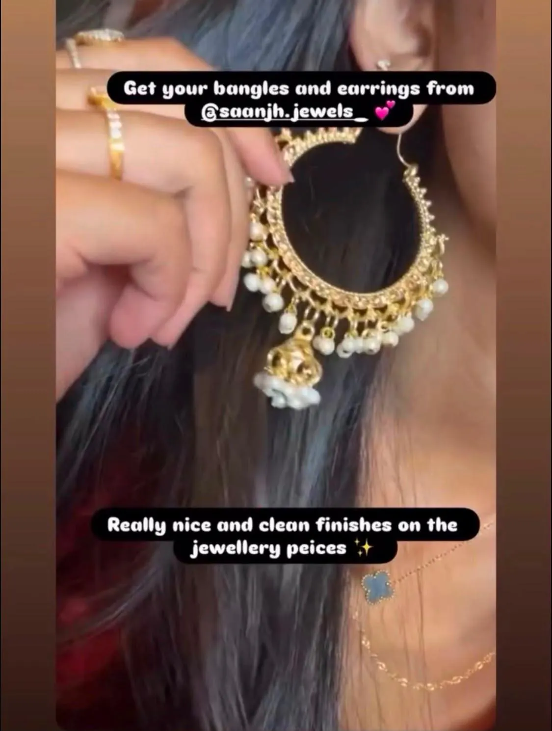 Close-up customer review of gold pearl chandbali earrings